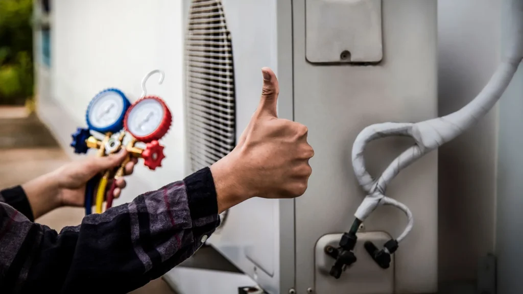 Licensed HVAC technician testing airflow and electrical components with professional diagnostic tools